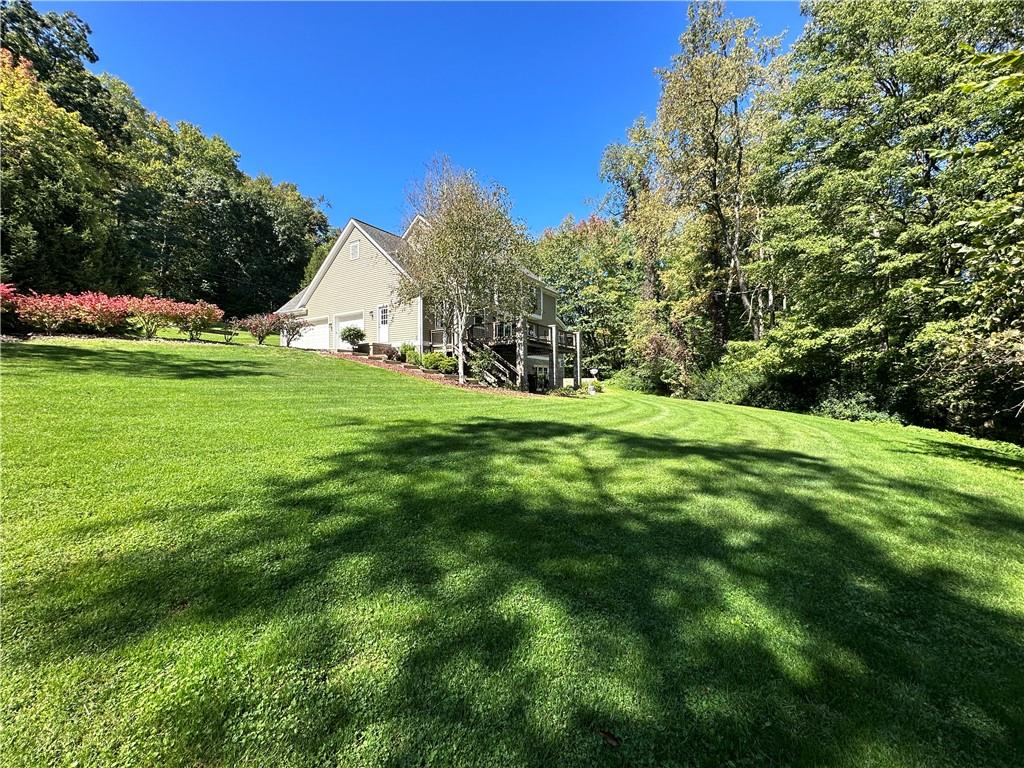 235 Stoup Road Mars, PA 16046 - Photo 48 of 50 a view of a green field with plants and trees