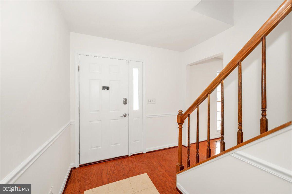 1404 Partridge Lane Bowie, MD 20721 - Photo 11 of 78 a view of an entryway with wooden floor