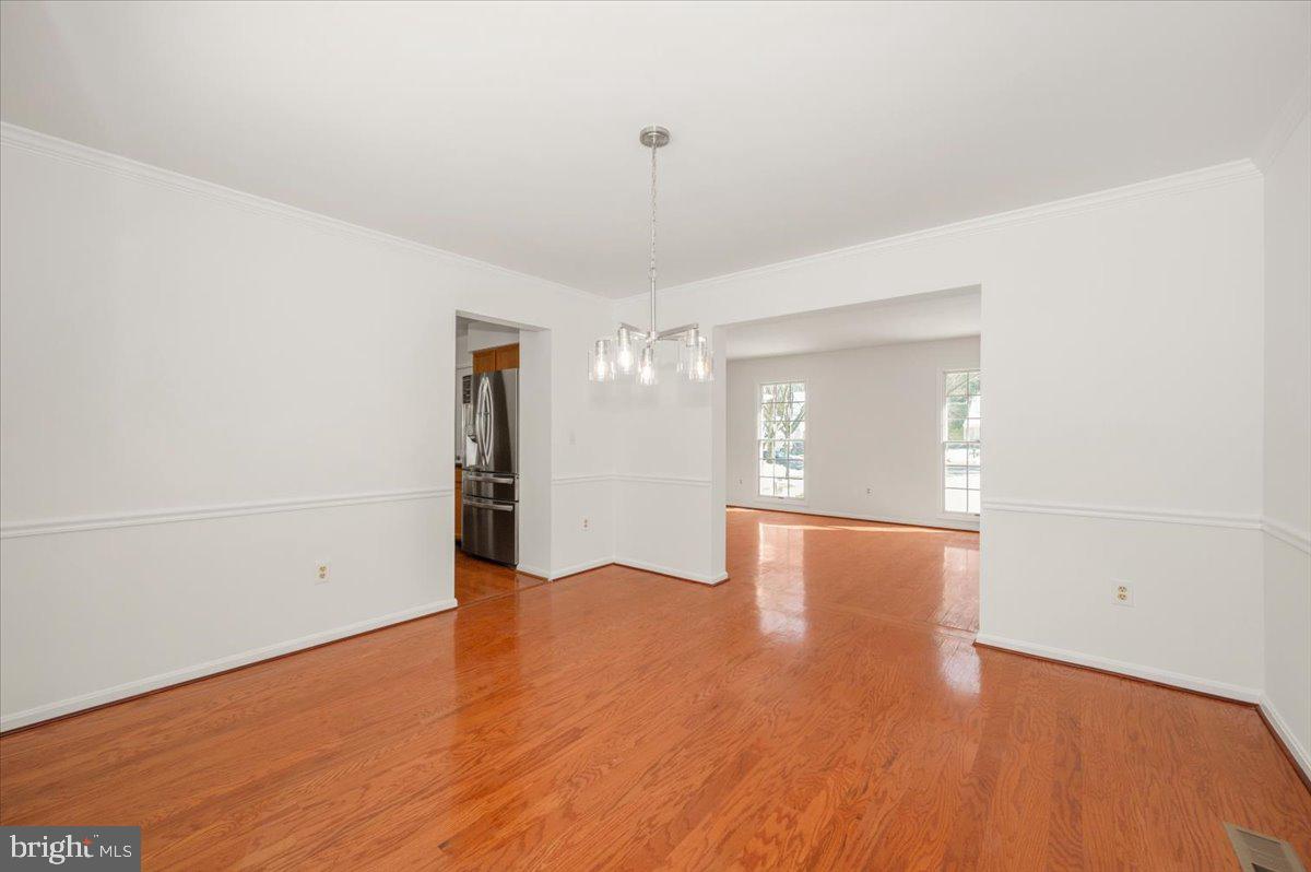 1404 Partridge Lane Bowie, MD 20721 - Photo 28 of 78 a view of an empty room with wooden floor and a window