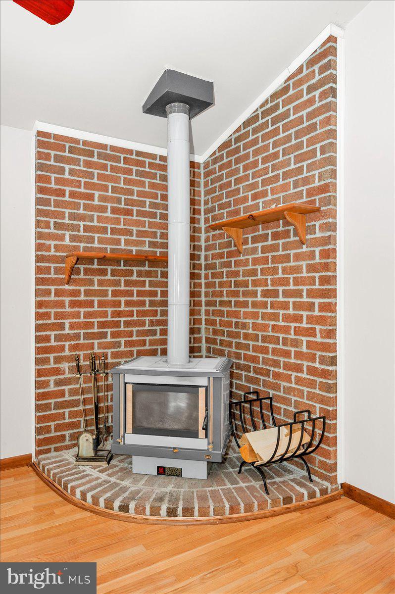 1404 Partridge Lane Bowie, MD 20721 - Photo 31 of 78 a view of a fireplace and chair in the room