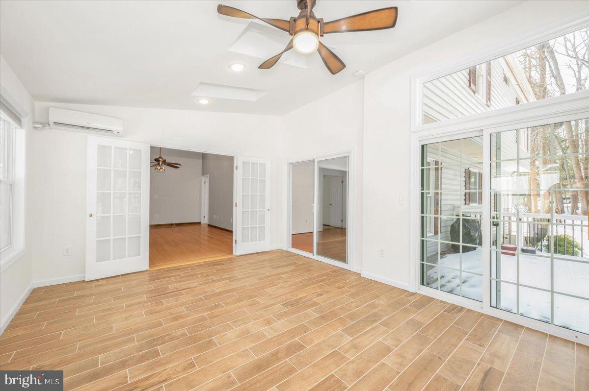 1404 Partridge Lane Bowie, MD 20721 - Photo 37 of 78 a view of empty room with wooden floor and fan