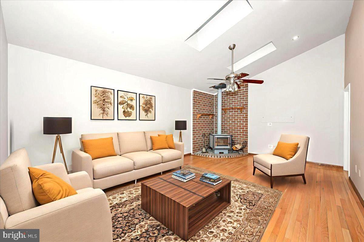 1404 Partridge Lane Bowie, MD 20721 - Photo 38 of 78 a living room with furniture a rug and a chandelier