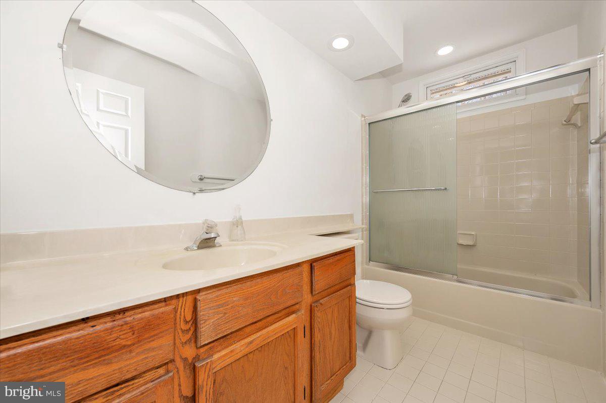 1404 Partridge Lane Bowie, MD 20721 - Photo 57 of 78 a bathroom with a sink a toilet and shower