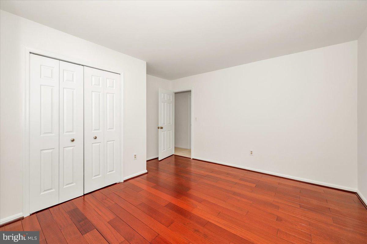 1404 Partridge Lane Bowie, MD 20721 - Photo 60 of 78 a view of an empty room with wooden floor