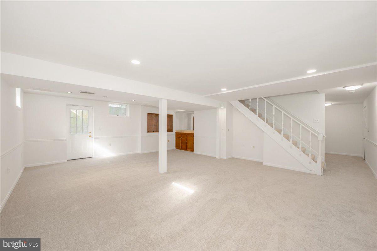 1404 Partridge Lane Bowie, MD 20721 - Photo 70 of 78 a view of an empty room with wooden floor