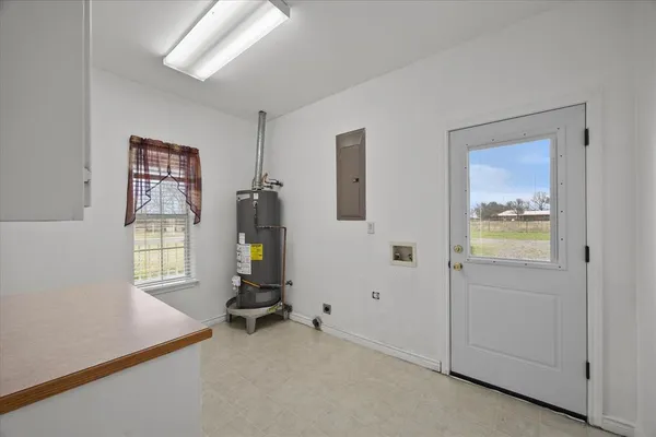 a view of room with workspace and windows