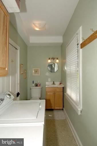 202 Edwards Ferry Road Northeast Leesburg, VA 20176 - Photo 21 of 28 LAUNDRY ROOM WITH POWDER ROOM AREA