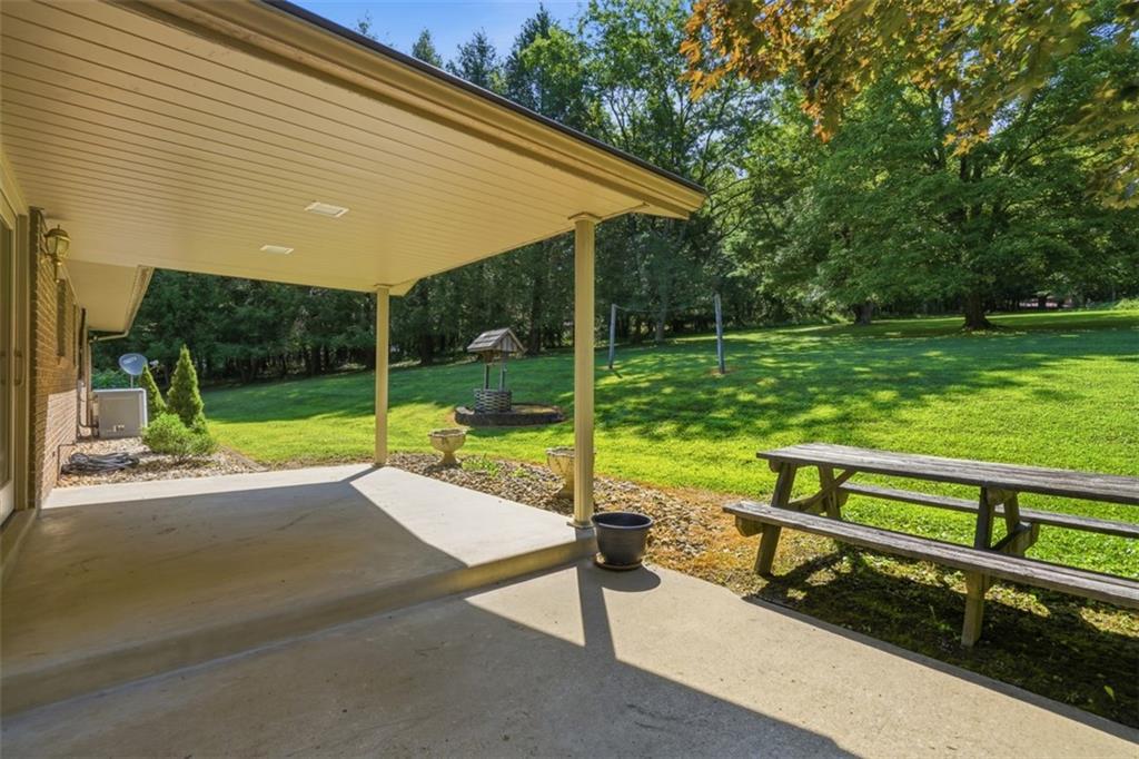 62 Chippewa Road Bentleyville, PA 15314 - Photo 25 of 34 The large covered patio opens to the beautiful back yard.