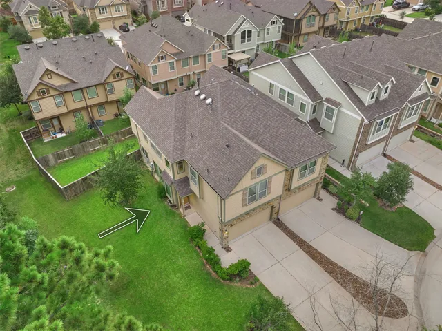 an aerial view of a house with a garden