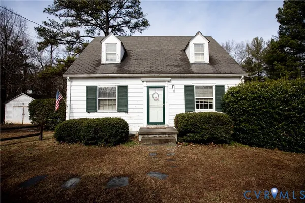 a kitchen with stainless steel appliances granite countertop a stove a sink and white cabinets