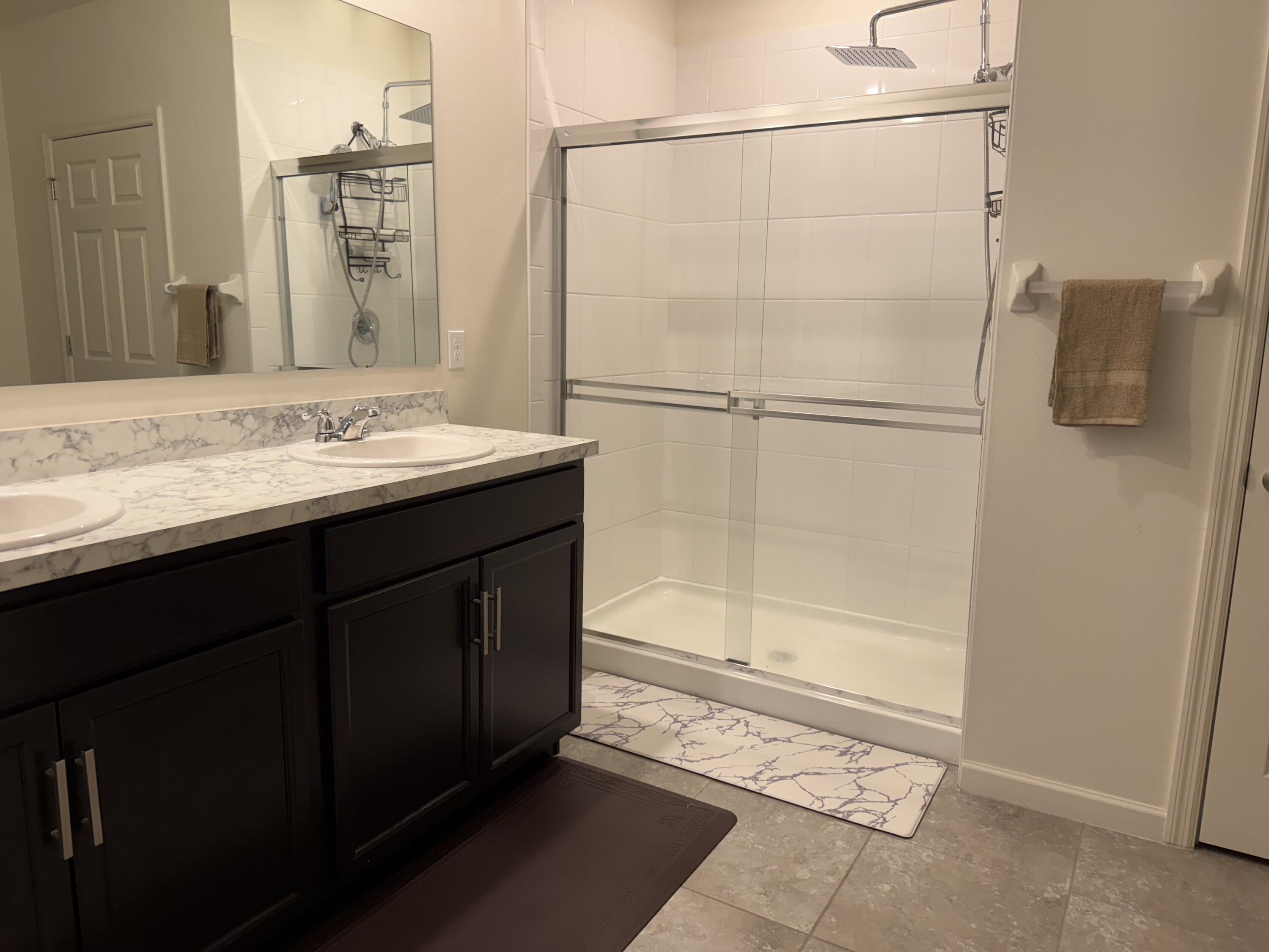 9511 Potomac Drive Fort Pierce, FL 34945 - Photo 18 of 26 a bathroom with a sink and a mirror