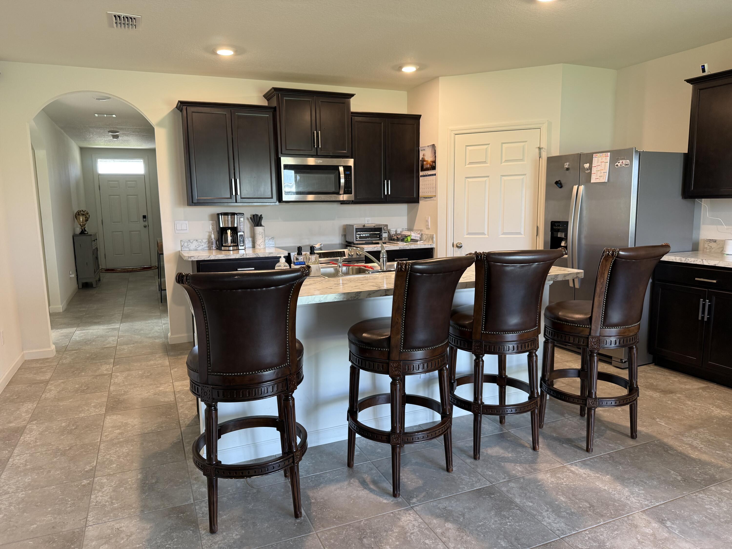 9511 Potomac Drive Fort Pierce, FL 34945 - Photo 21 of 26 a view of a dining room with furniture