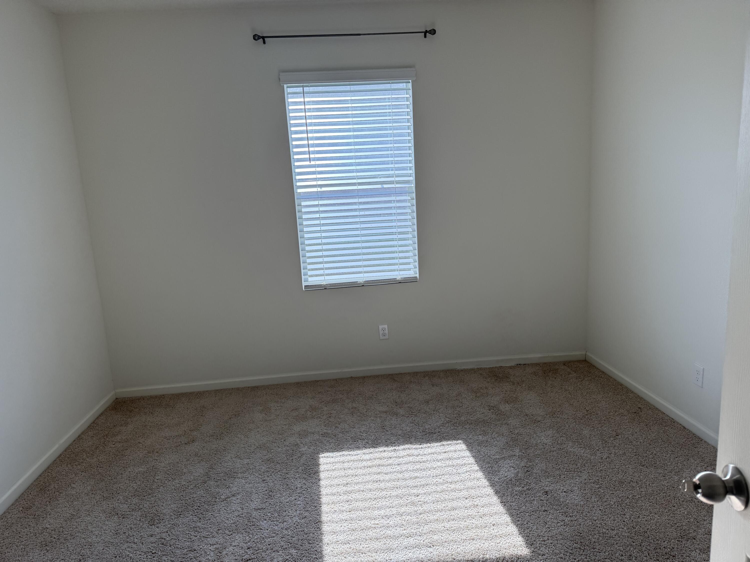 9511 Potomac Drive Fort Pierce, FL 34945 - Photo 7 of 26 an empty room with a window
