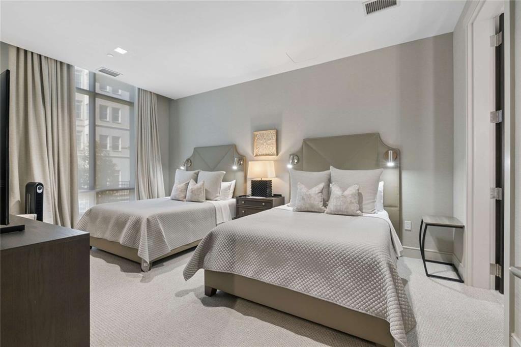 2520 Peachtree Road, Unit 603 Atlanta, GA 30305 - Photo 61 of 91 a bedroom with two beds and large window