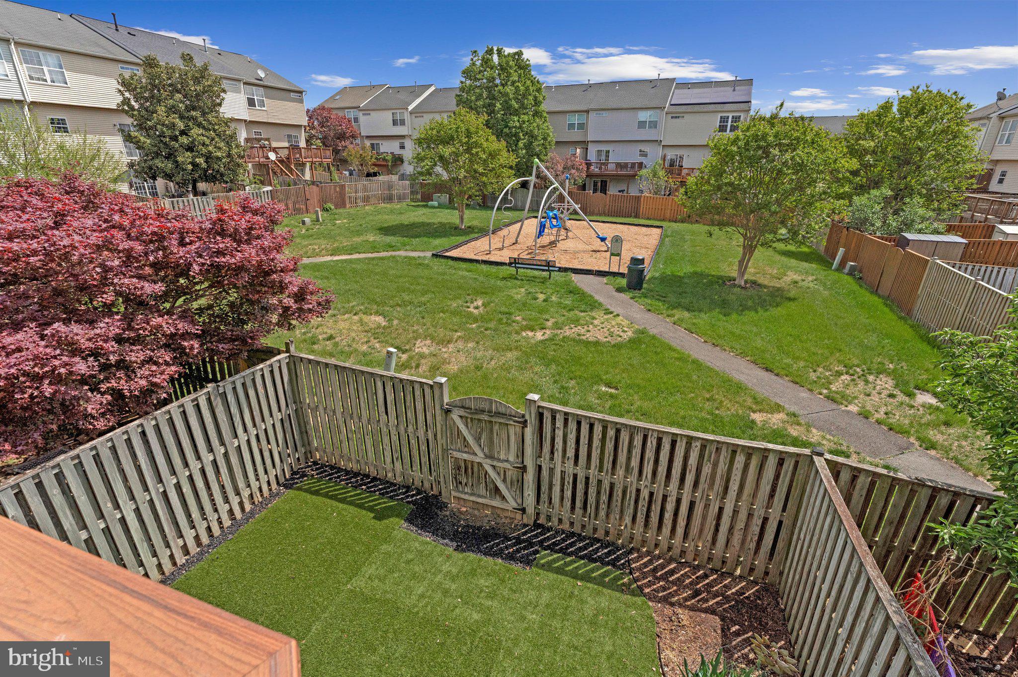 590 Tuliptree Square Northeast Leesburg, VA 20176 - Photo 21 of 54 a view of a porch with a yard