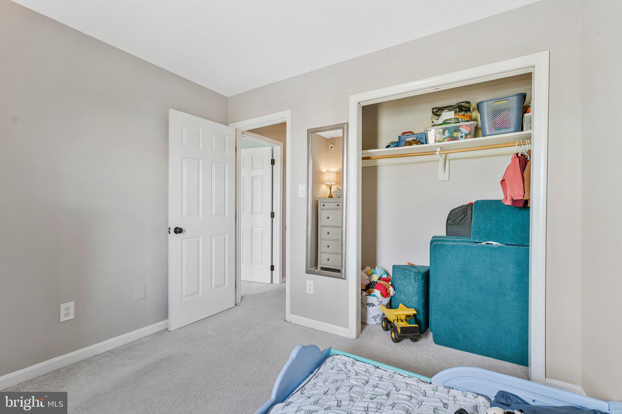 590 Tuliptree Square Northeast Leesburg, VA 20176 - Photo 24 of 54 a living room with baby furniture and a wooden floor