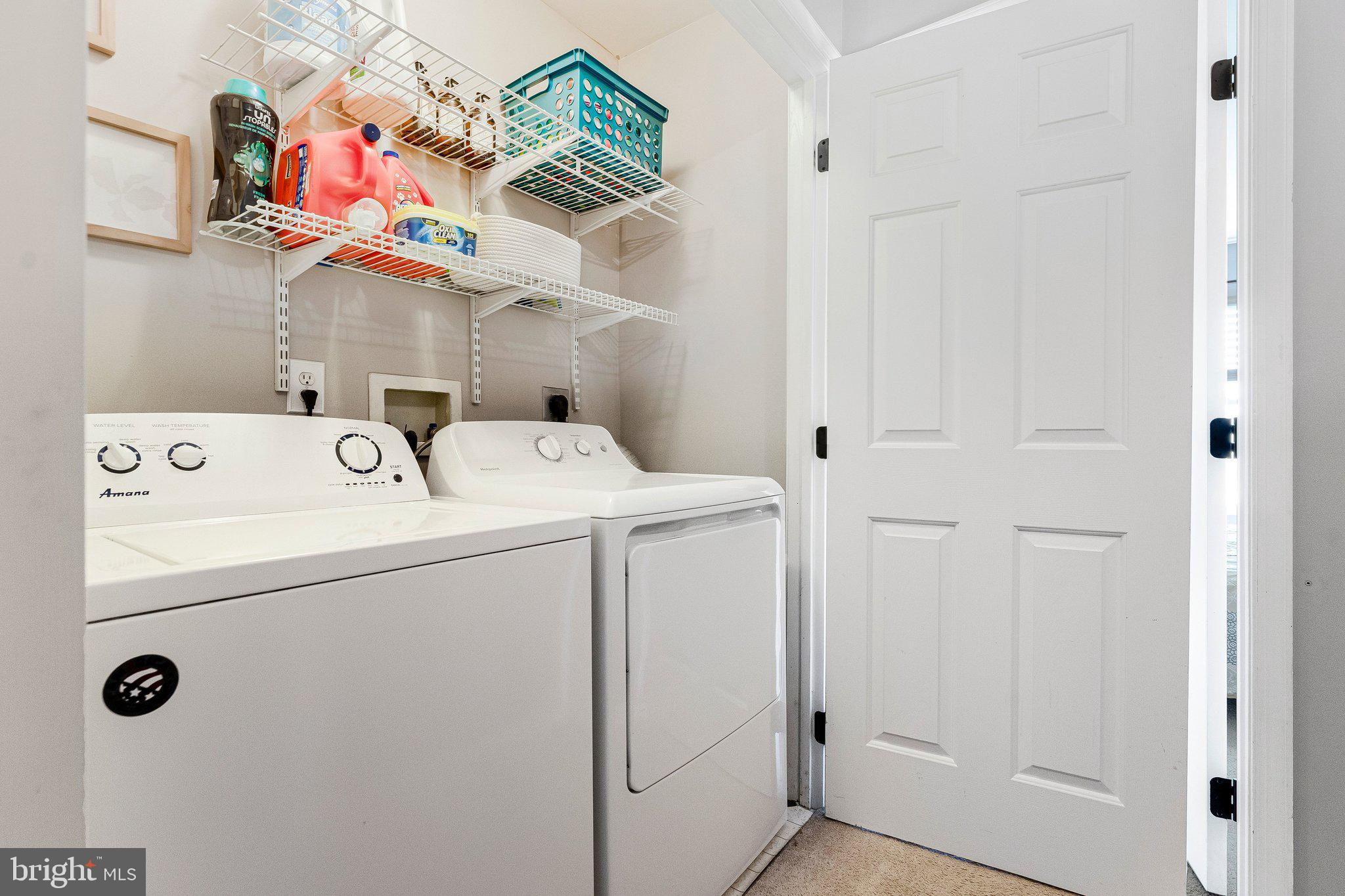 590 Tuliptree Square Northeast Leesburg, VA 20176 - Photo 27 of 54 a utility room with dryer and washer