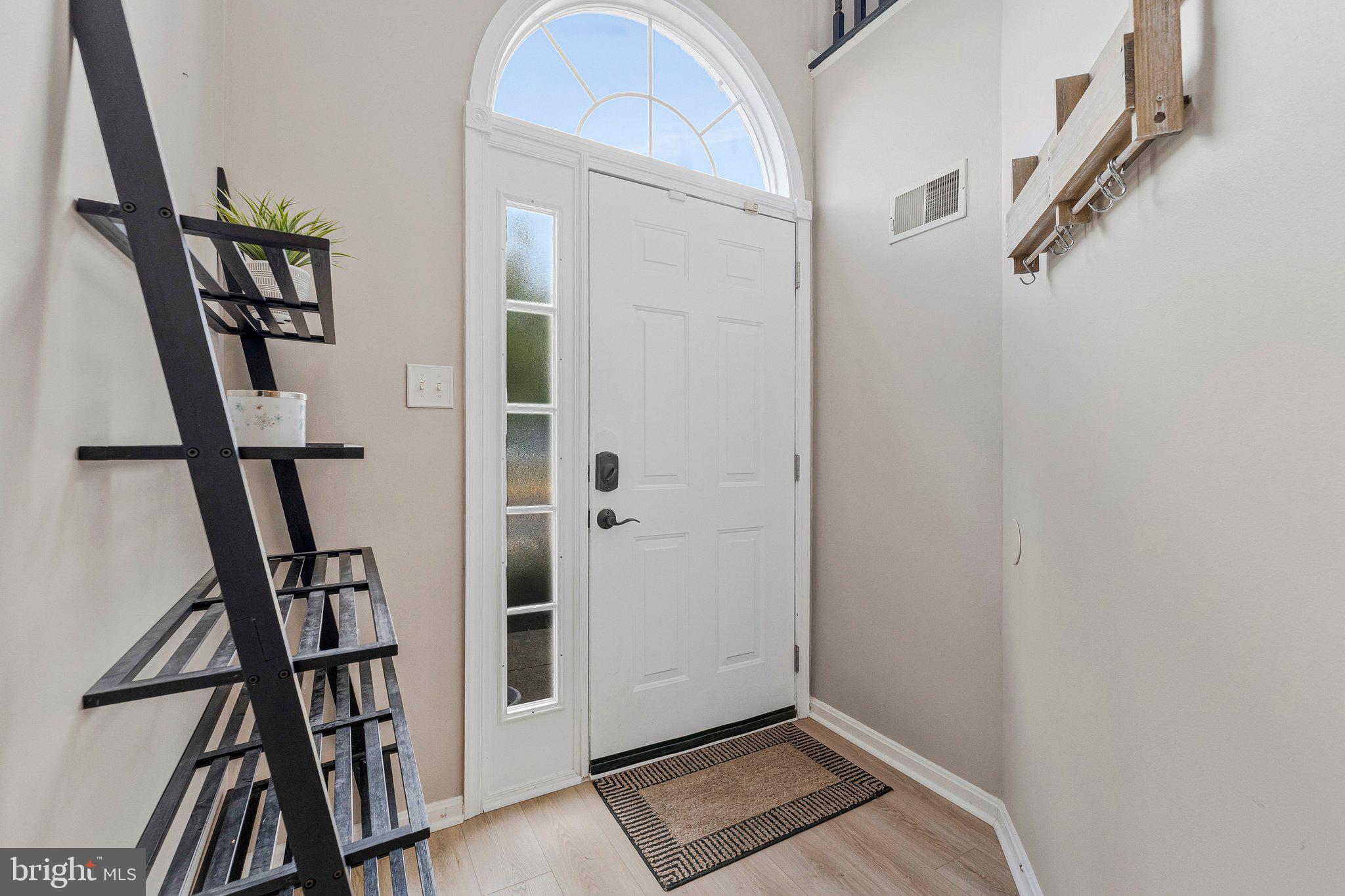 590 Tuliptree Square Northeast Leesburg, VA 20176 - Photo 4 of 54 a view of an entryway with staircase