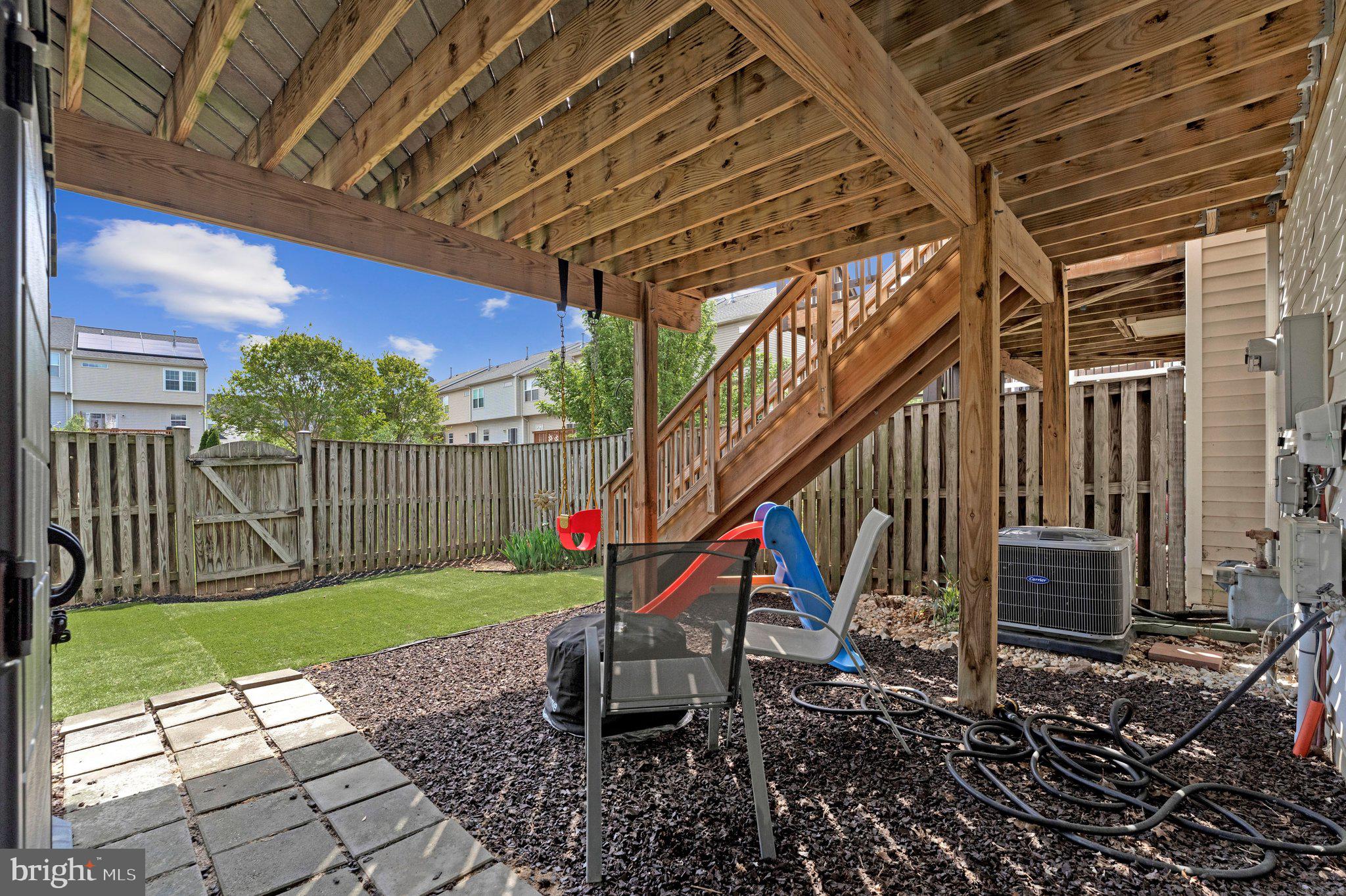 590 Tuliptree Square Northeast Leesburg, VA 20176 - Photo 44 of 54 a view of a couches in the patio with a backyard