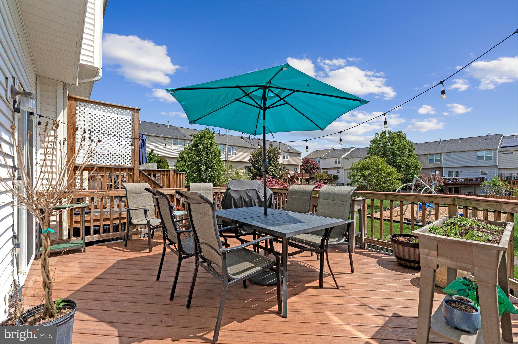 590 Tuliptree Square Northeast Leesburg, VA 20176 - Photo 50 of 54 a view of a patio with furniture and a yard