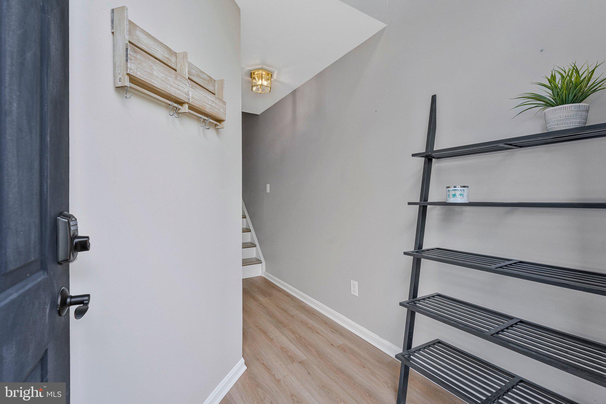 590 Tuliptree Square Northeast Leesburg, VA 20176 - Photo 5 of 54 a view of a room with rack on the wall