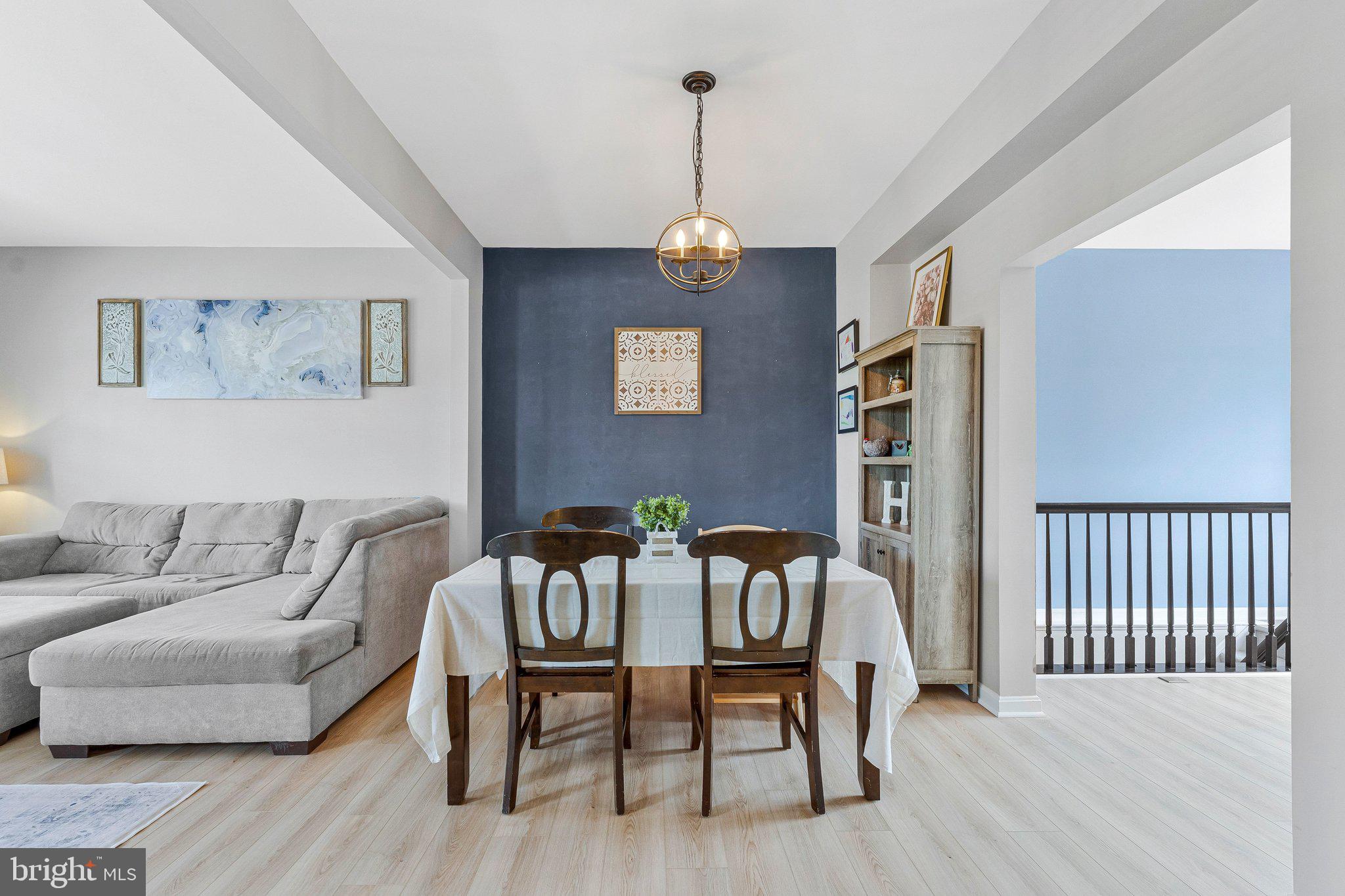 590 Tuliptree Square Northeast Leesburg, VA 20176 - Photo 7 of 54 a view of a livingroom with furniture and wooden floor