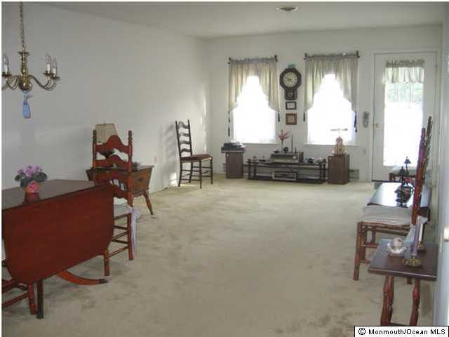 14 Alpine Road, Unit B Manchester Township, NJ 08759 - Photo 2 of 3 a living room with furniture and a large window