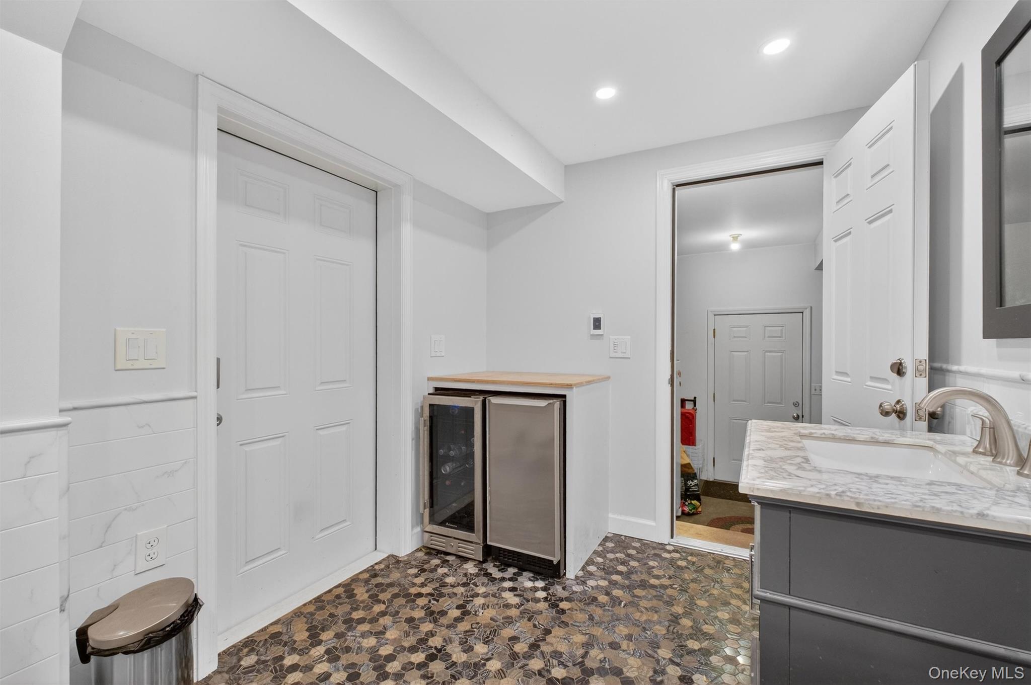 23 Ruth Road Cortlandt Manor, NY 10567 - Photo 31 of 50 Full bath with beverage fridge provides direct access to outdoor hot tub.