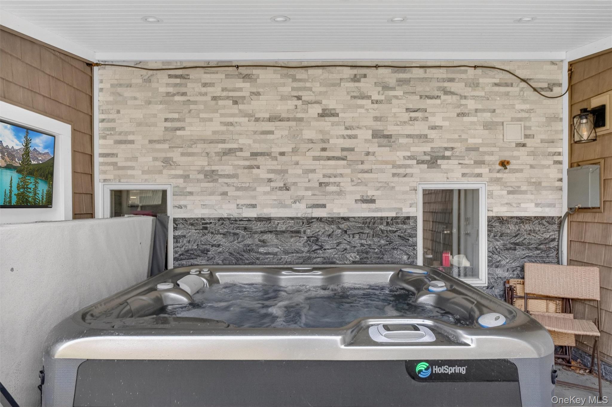 23 Ruth Road Cortlandt Manor, NY 10567 - Photo 36 of 50 Watch some TV and have a drink while you're relaxing in your hot tub.