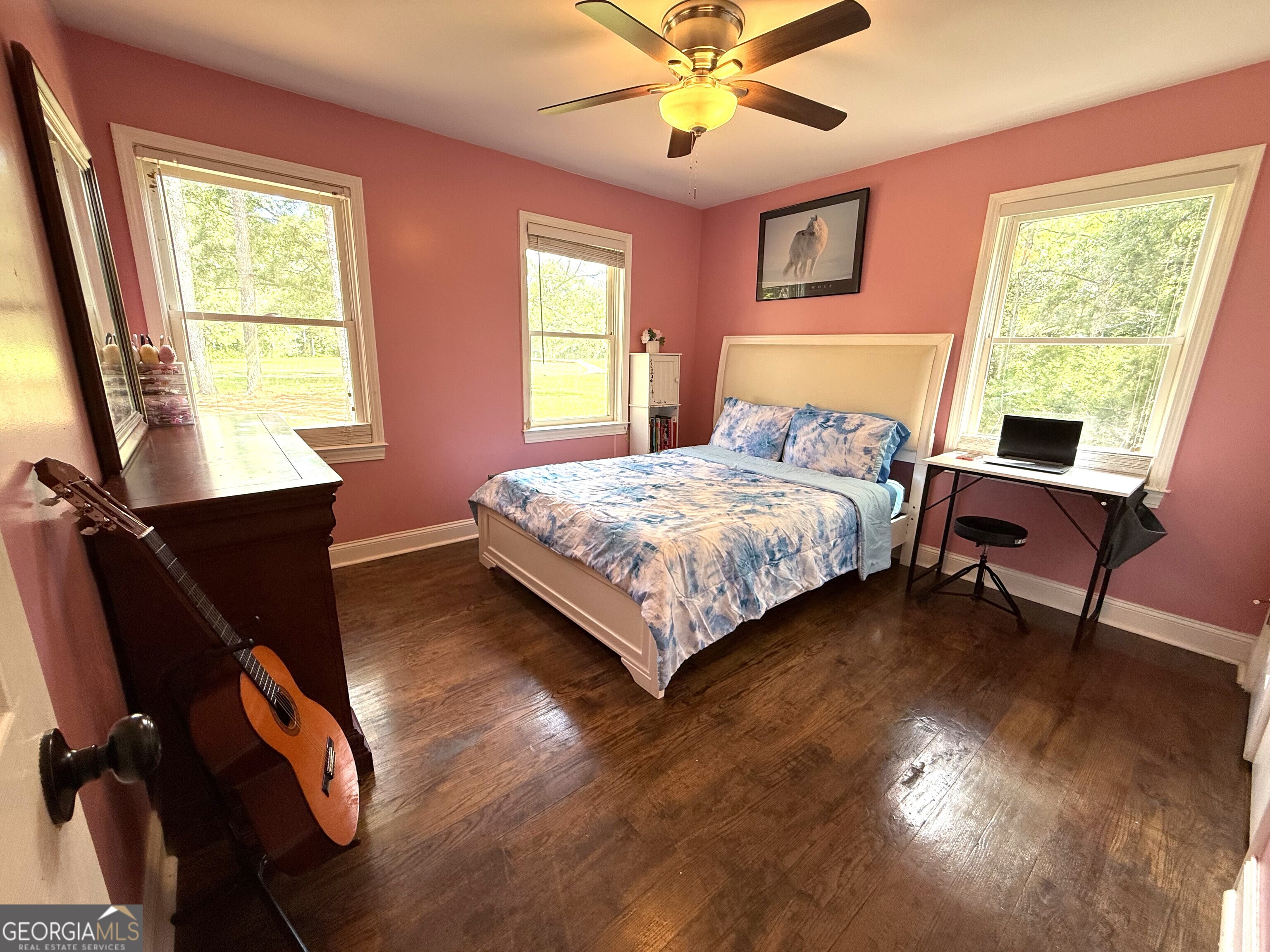 725 Musgrove Road Griffin, GA 30223 - Photo 28 of 52 a bedroom with a bed dresser and a window