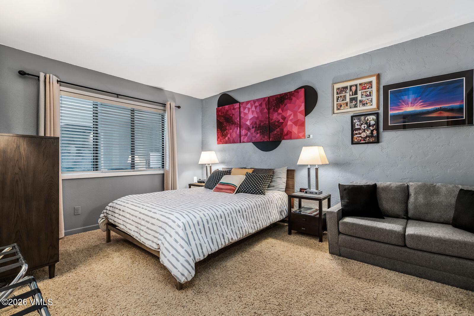 500 South Frontage Road East, Unit 308 Vail, CO 81657 - Photo 12 of 25 a bedroom with a bed couch and window
