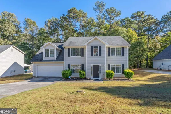 a view of a house with a swimming pool