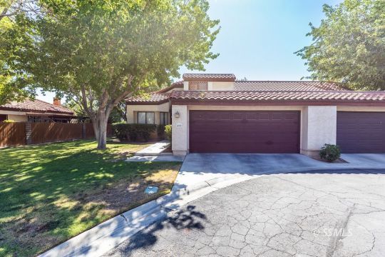 400 Tepatitlan Court Ridgecrest, CA 93555 - Photo 2 of 35 a front view of a house with a yard and garage