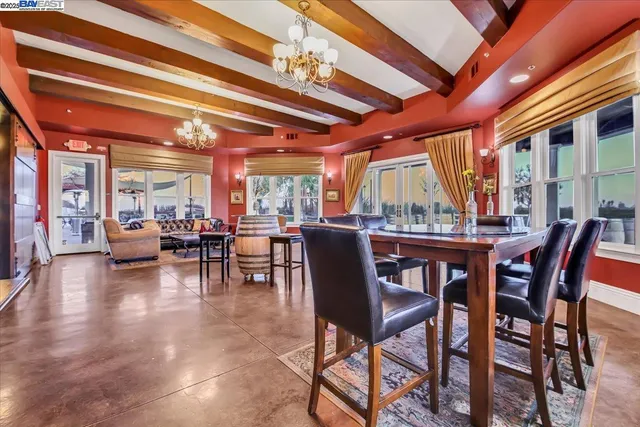 a living room with furniture and flowers