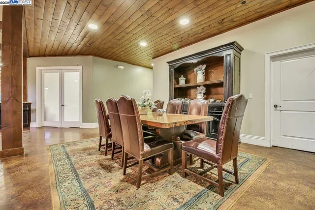 a kitchen with stainless steel appliances granite countertop a refrigerator and a stove