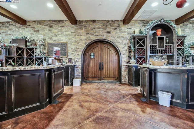 a room with lots of different furniture and flowers