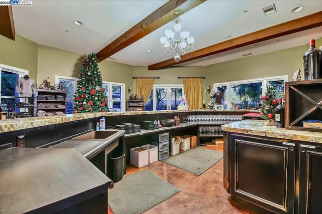 a view of a livingroom with furniture and a flat screen tv