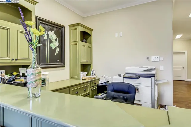a view of a patio with chairs and plants
