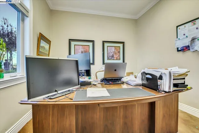 a group of people sitting outside of a house