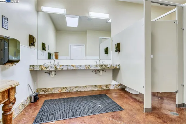 a view of an chairs and table in the patio