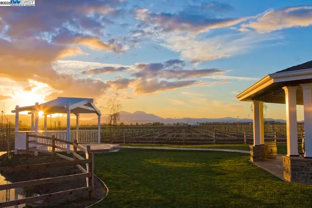 a view of a swimming pool with a yard