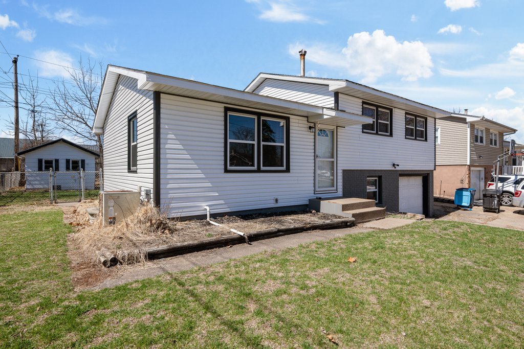 8012 10th Street West Rock Island, IL 61201 - Photo 1 of 27 a view of a house with backyard and sitting area