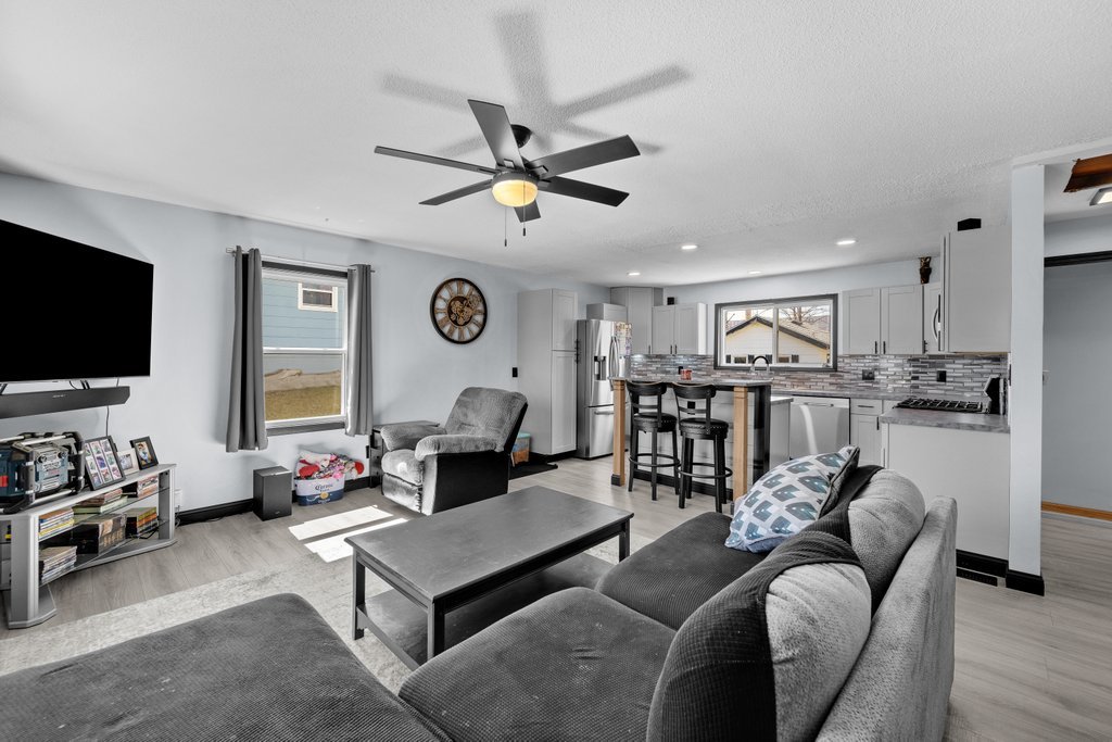 8012 10th Street West Rock Island, IL 61201 - Photo 11 of 27 a living room with furniture and a flat screen tv