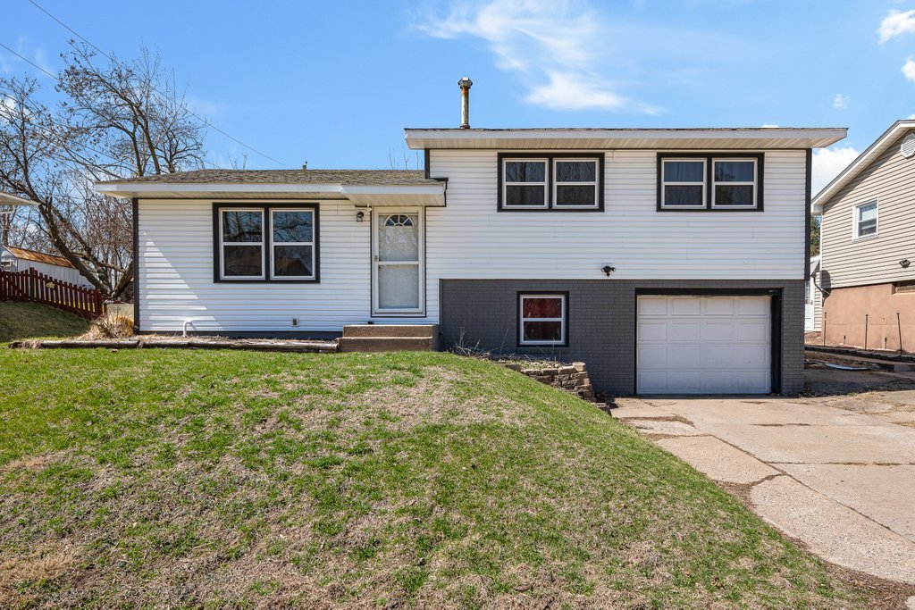 8012 10th Street West Rock Island, IL 61201 - Photo 2 of 27 a front view of house with yard