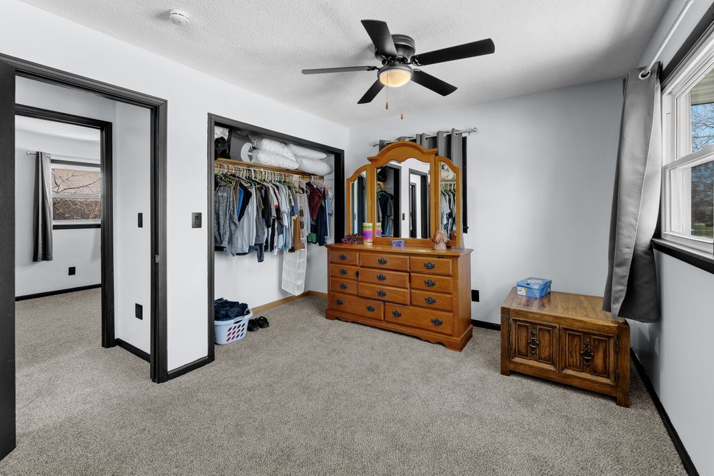 8012 10th Street West Rock Island, IL 61201 - Photo 21 of 27 a view of a livingroom with a ceiling fan