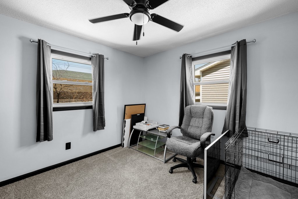 8012 10th Street West Rock Island, IL 61201 - Photo 23 of 27 a view of a workspace with furniture and a window