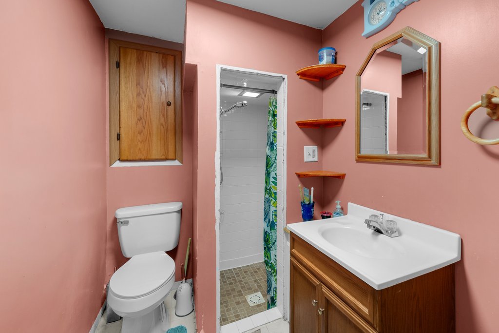 8012 10th Street West Rock Island, IL 61201 - Photo 26 of 27 a bathroom with a sink toilet and mirror