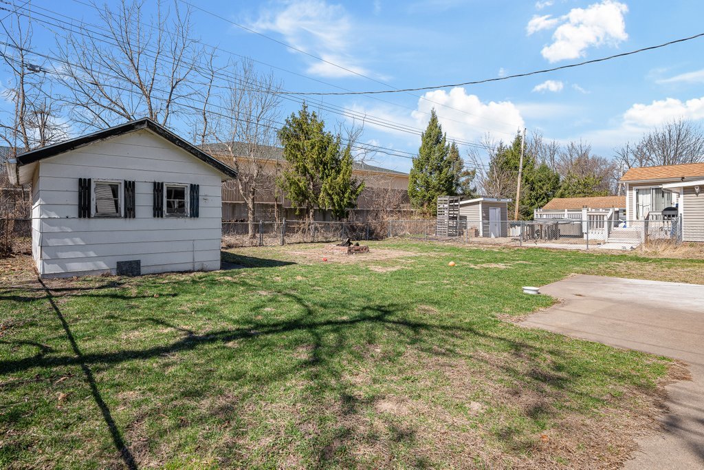 8012 10th Street West Rock Island, IL 61201 - Photo 5 of 27 a backyard of a house with seating space
