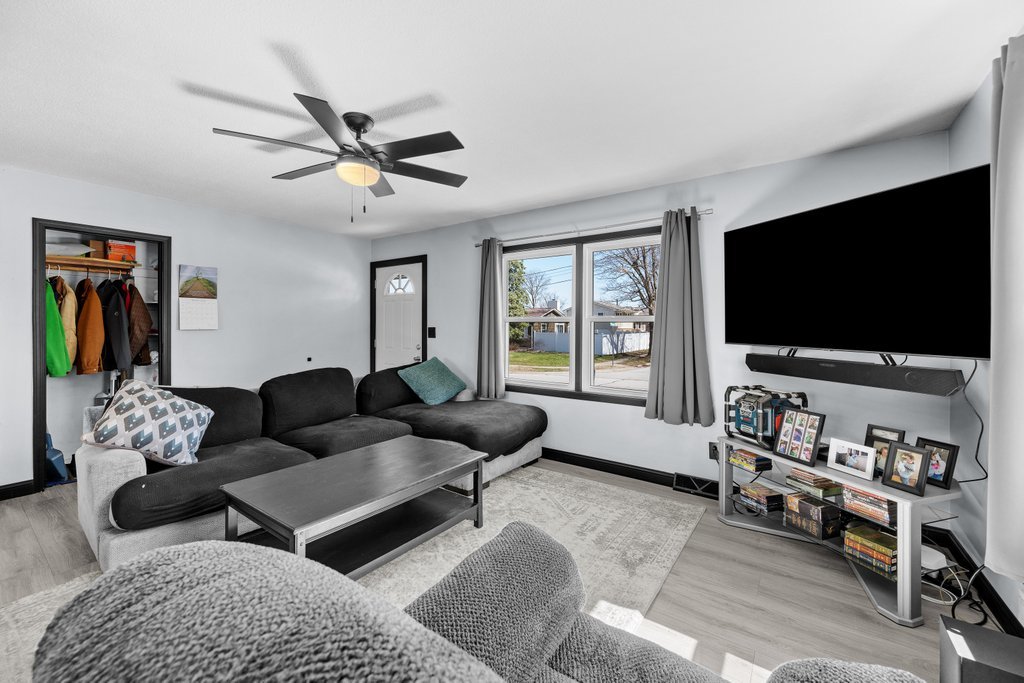 8012 10th Street West Rock Island, IL 61201 - Photo 8 of 27 a living room with furniture and a flat screen tv