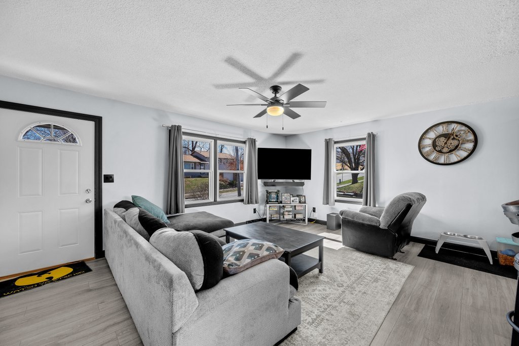 8012 10th Street West Rock Island, IL 61201 - Photo 10 of 27 a living room with furniture and a flat screen tv